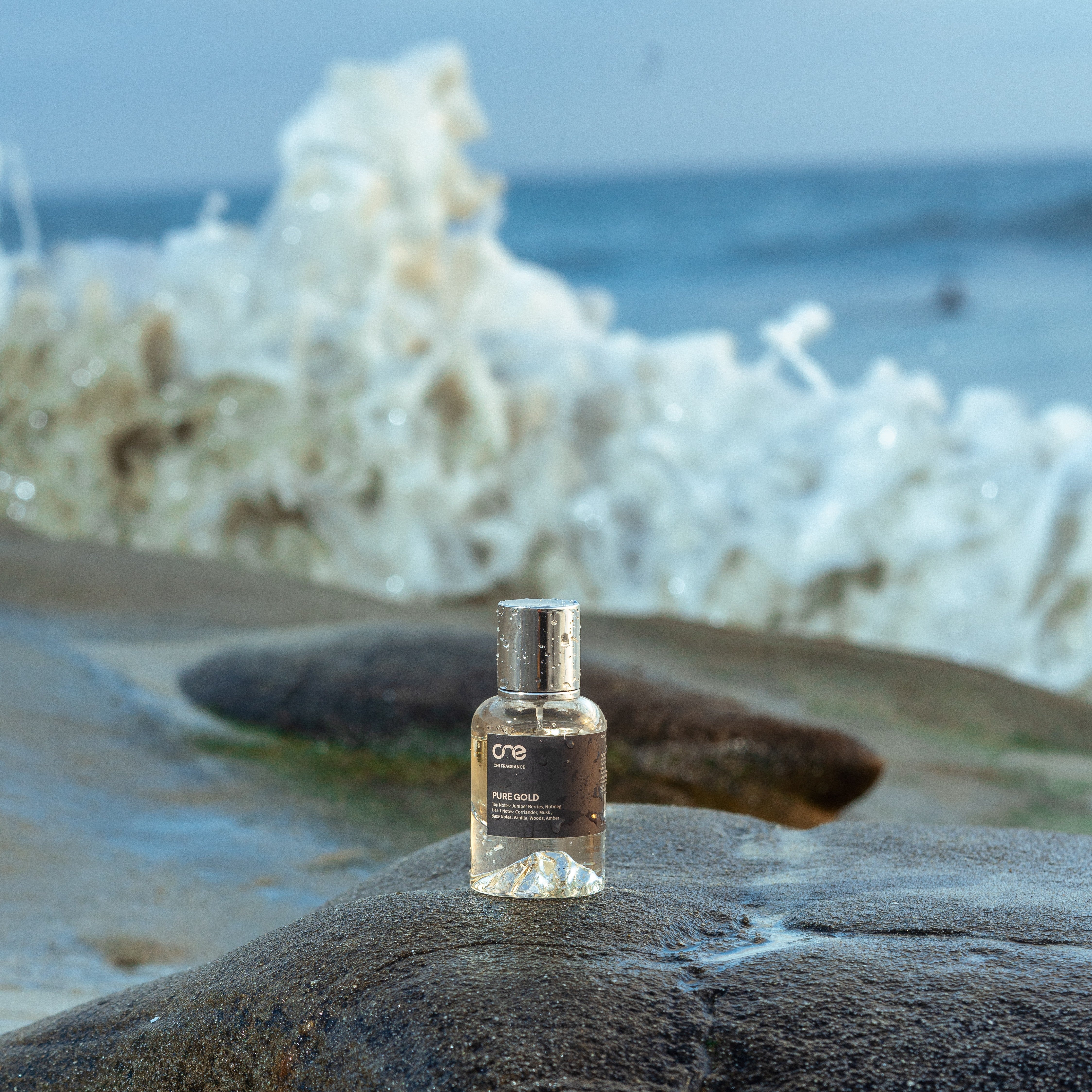 CN1 Fragrance Pure Gold on the beach with waves for summer 2025