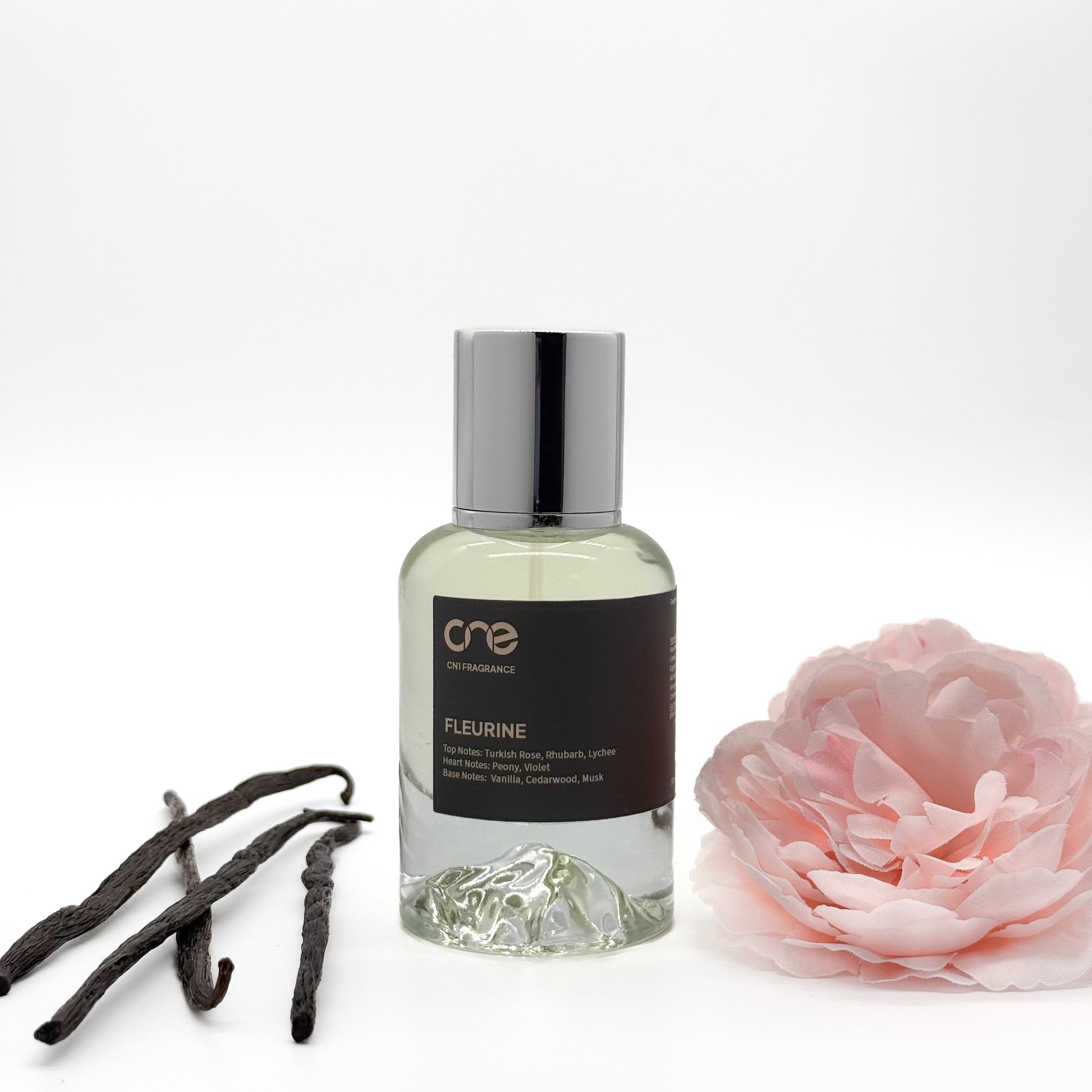 Fleurine by CN1 Fragrance – A luxurious floral fragrance inspired by De Marly Delina. Top notes of vibrant rhubarb and lychee, heart notes of delicate rose and peony, with a rich base of creamy sandalwood and musk.