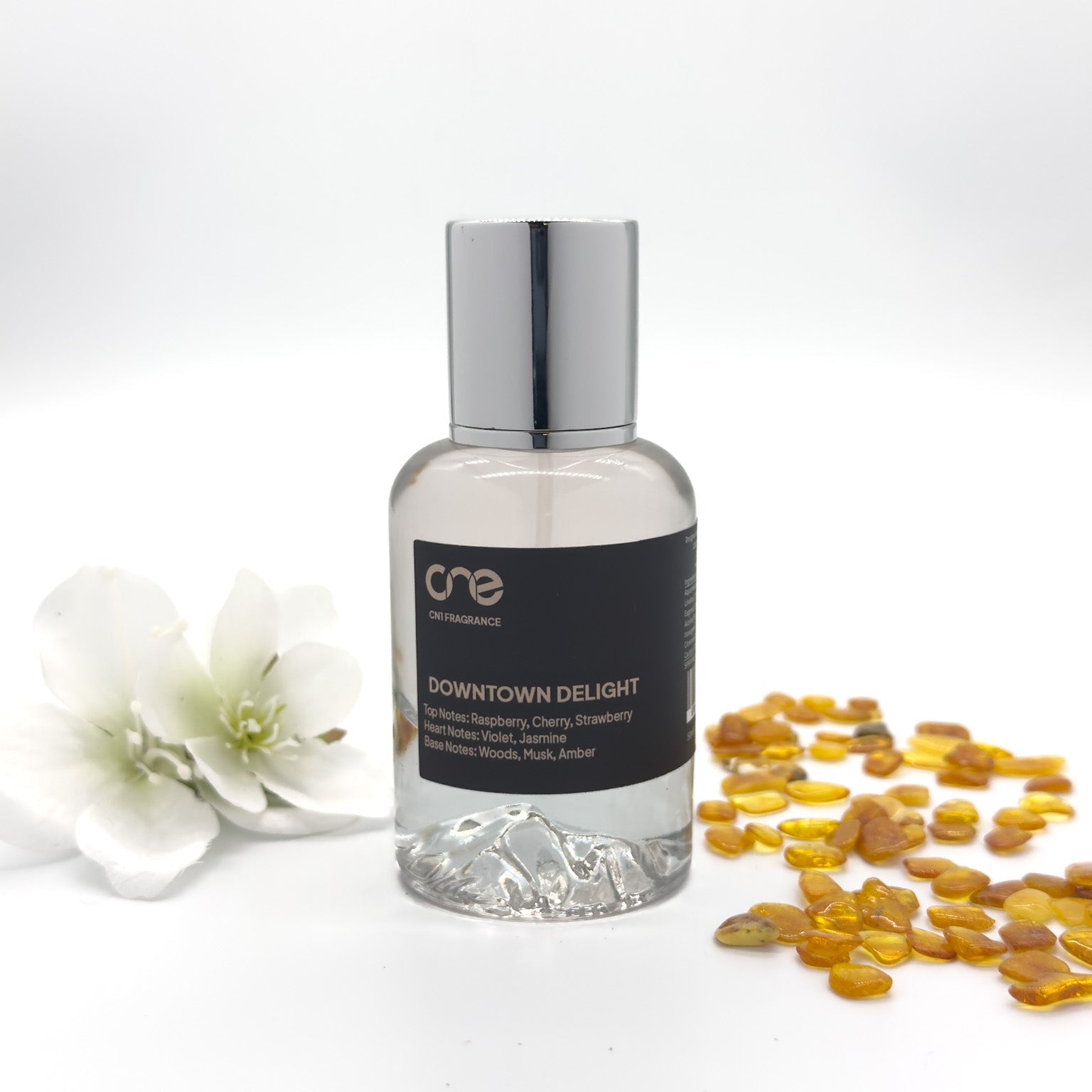 Ensure all images have descriptive alt text, such as "Downtown Delight perfume bottle by CN1 Fragrance