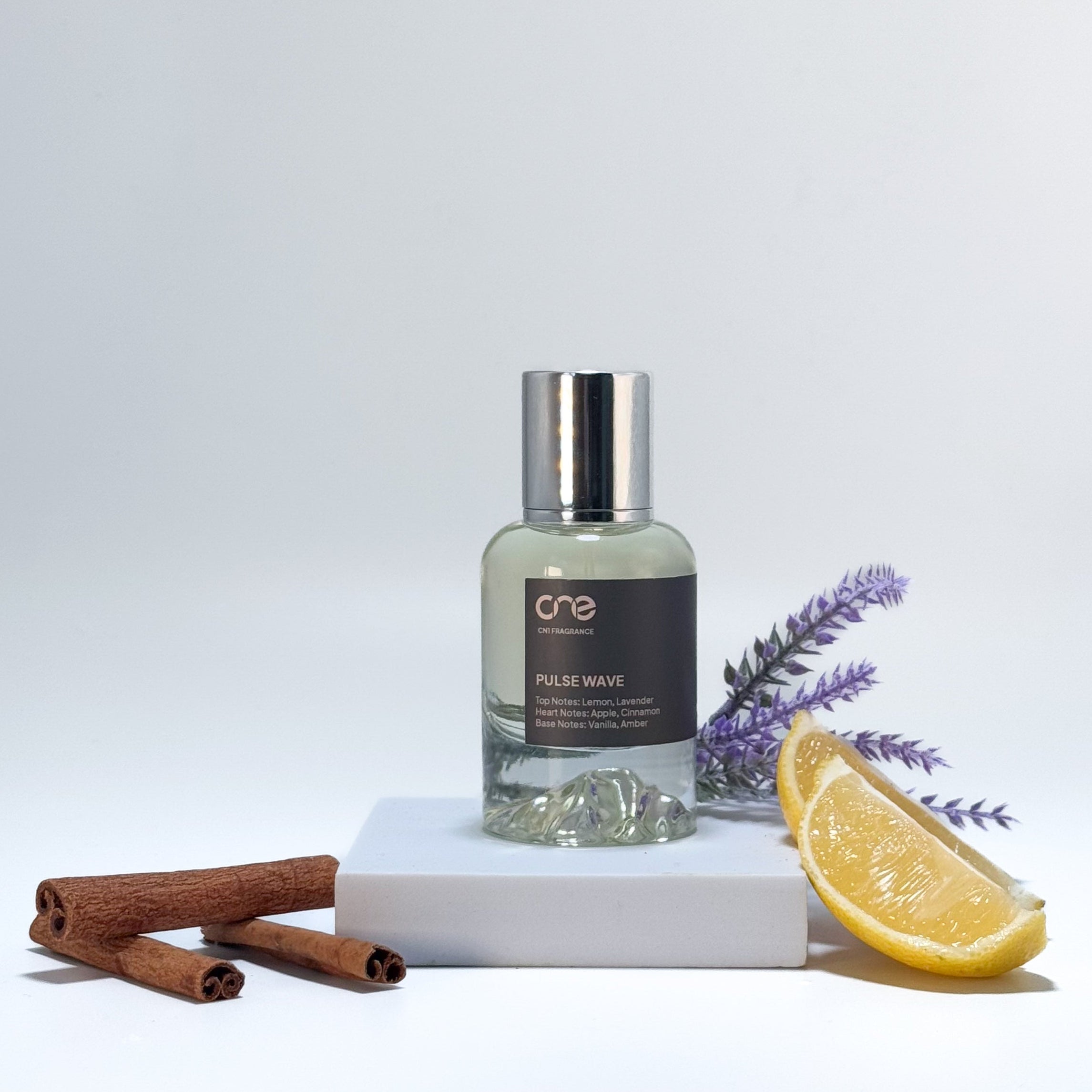 Elegant bottle of Pulse Wave by CN1 Fragrance, featuring a dynamic and refreshing scent with top notes of citrus and mint, heart notes of lavender and geranium, and base notes of cedarwood and musk. Perfect for those who embrace energy and vitality