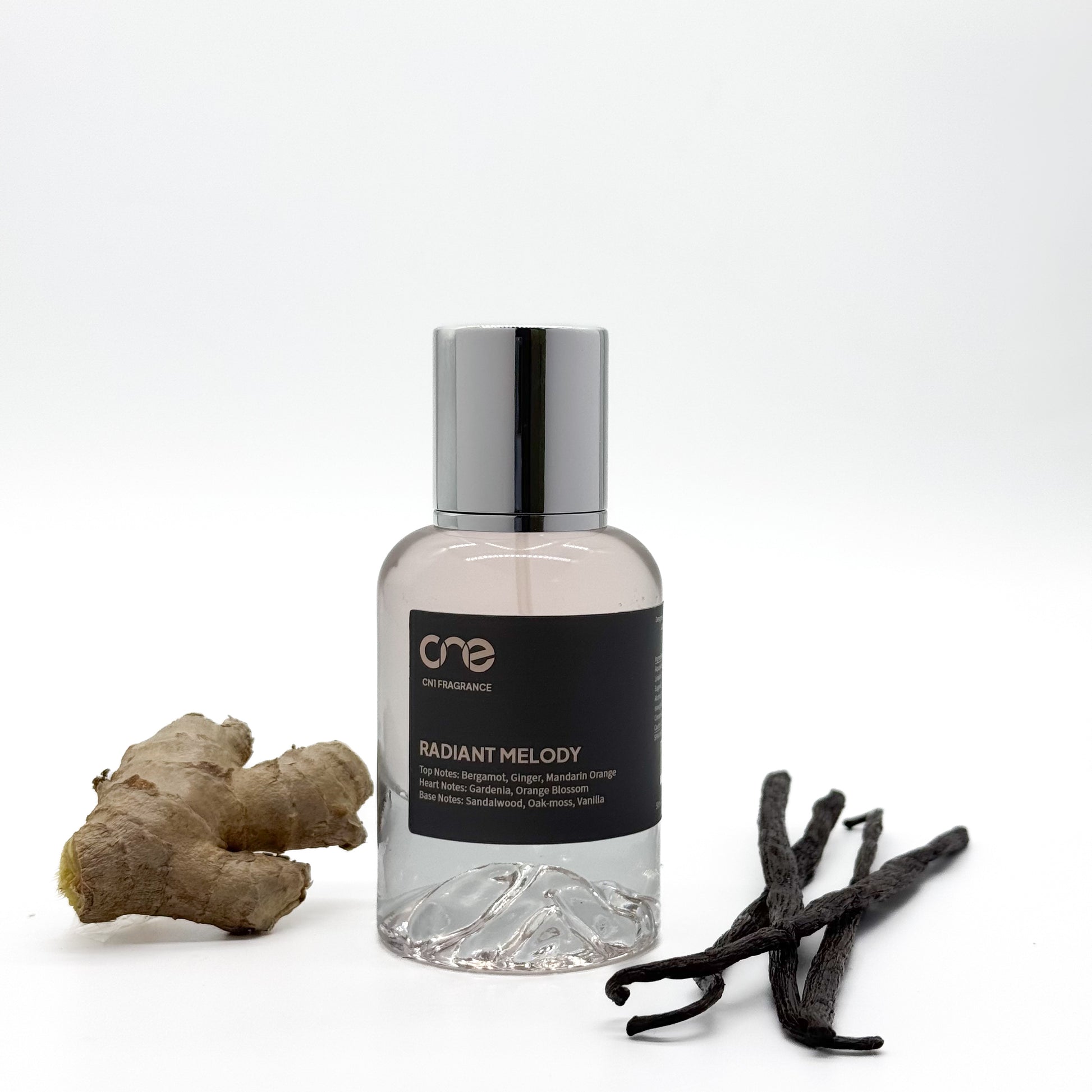 Radiant Melody by CN1 Fragrance: A harmonious blend of vibrant florals and warm, woody undertones. Top notes of citrus zest and fresh blossoms lead to a heart of jasmine and rose, while the base reveals a touch of amber and sandalwood, creating an alluring and lasting impression.