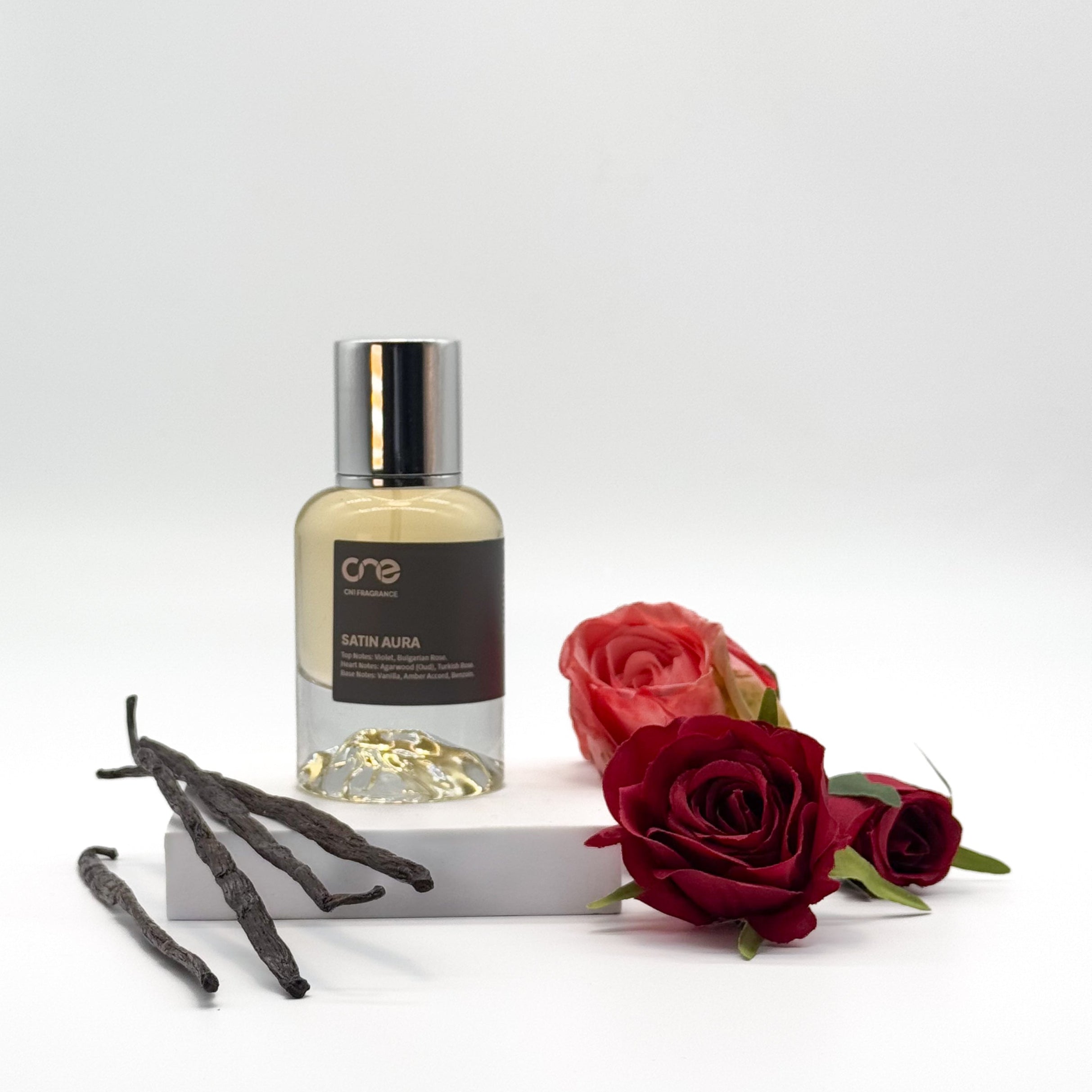 Elegant bottle of Satin Aura by CN1 Fragrance, featuring a luxurious scent with top notes of violet and Bulgarian rose, heart notes of agarwood (oud) and Turkish rose, and base notes of vanilla, amber accord, and benzoin. Inspired by MFK Oud Satin Mood, perfect for special occasions and date nights