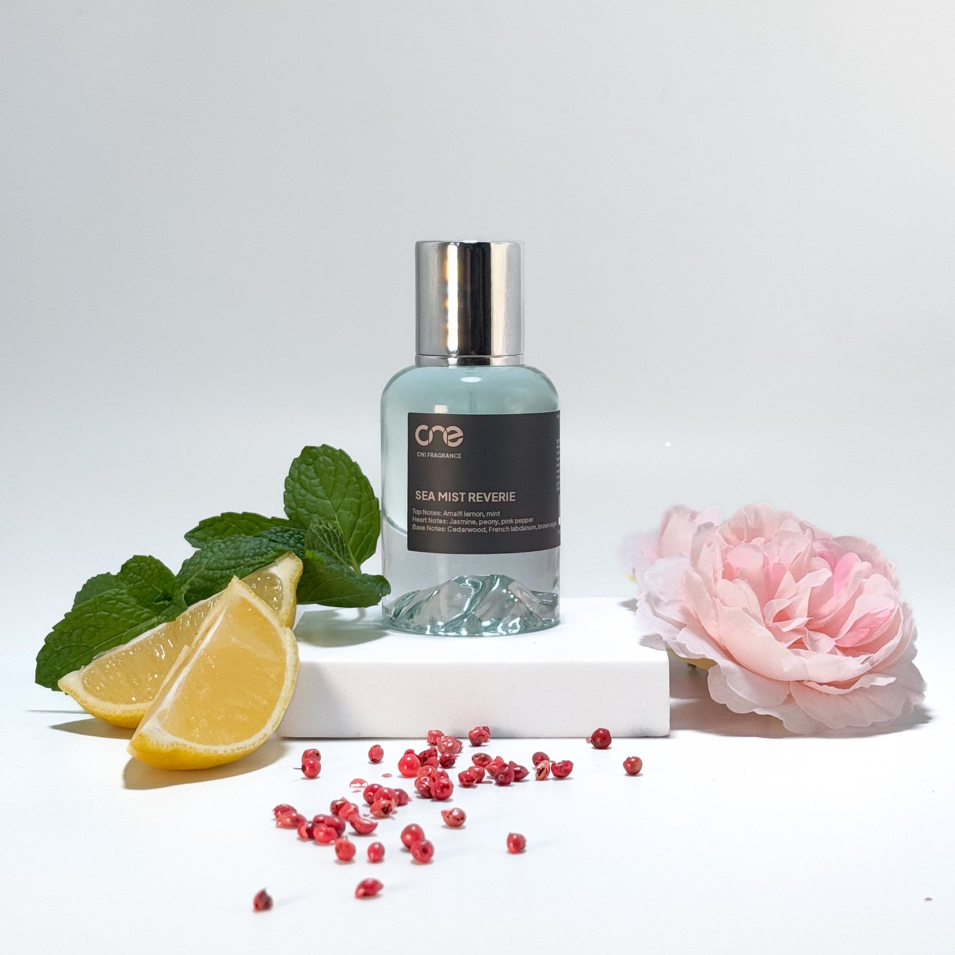 Elegant bottle of Sea Mist Reverie by CN1 Fragrance, featuring a refreshing blend of Amalfi lemon, mint, jasmine, peony, pink pepper, cedarwood, French labdanum, and brown sugar. Inspired by Giorgio Armani Acqua Di Gioia, perfect for an invigorating and uplifting experience