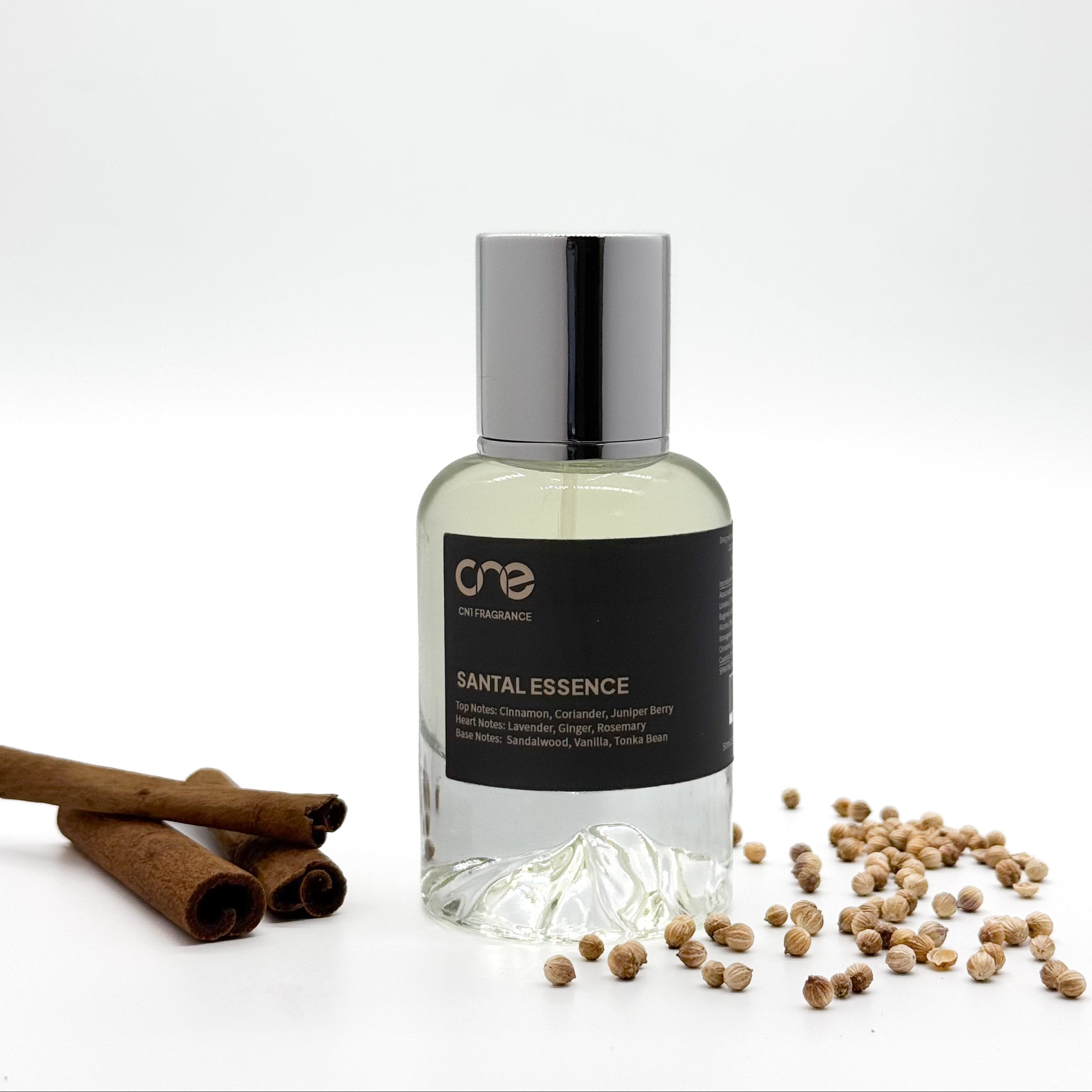 Santal Essence by CN1 Fragrance - A luxurious perfume bottle surrounded by warm sandalwood, spicy cardamom, and creamy amber notes, evoking a rich and sensual aroma