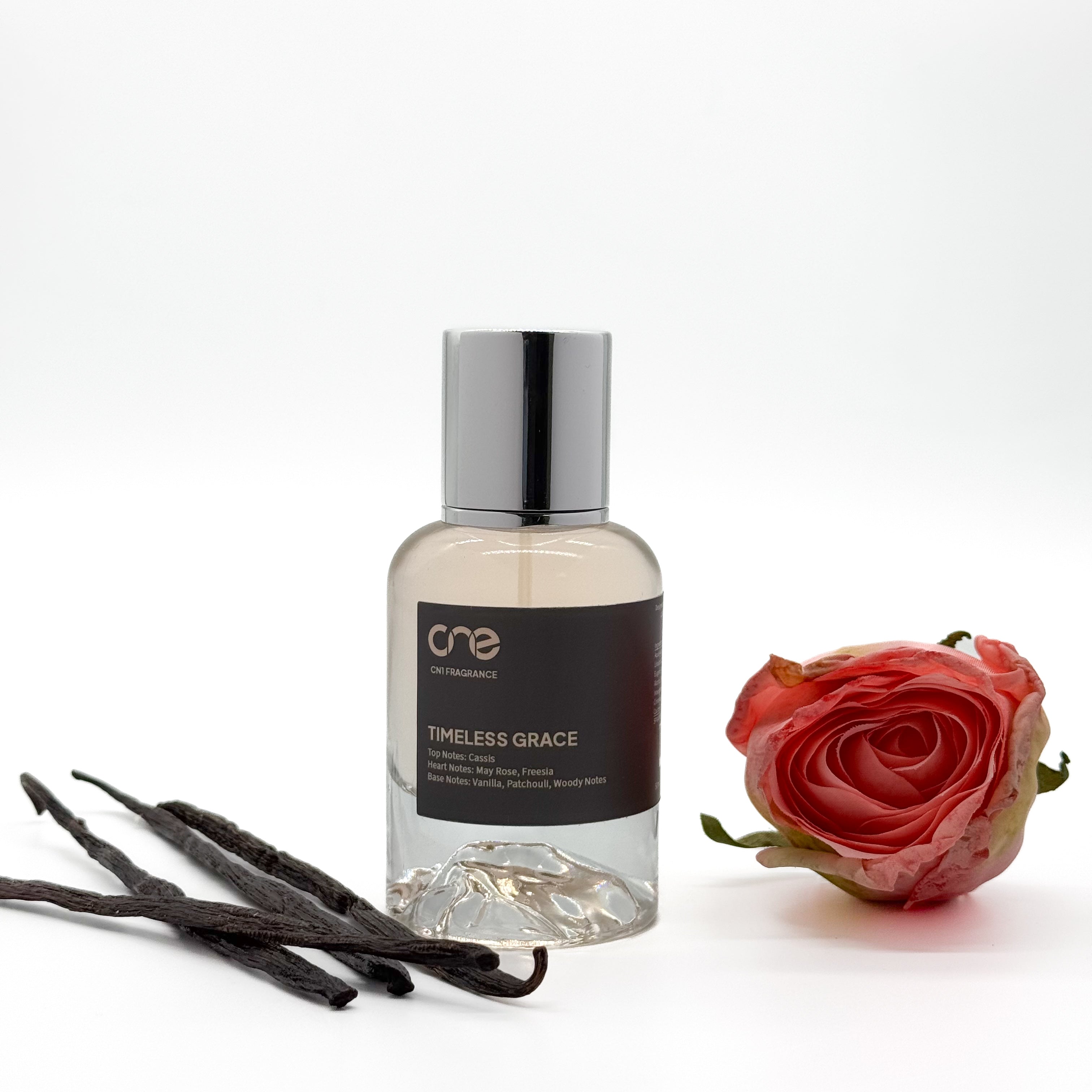 Timeless Grace Eau De Parfum by CN1 Fragrance – A luxurious blend of floral, fruity, and musky notes, featuring top notes of bergamot and pear, a heart of jasmine and rose, and a base of amber and musk. The perfect fragrance for a sophisticated and elegant experience.